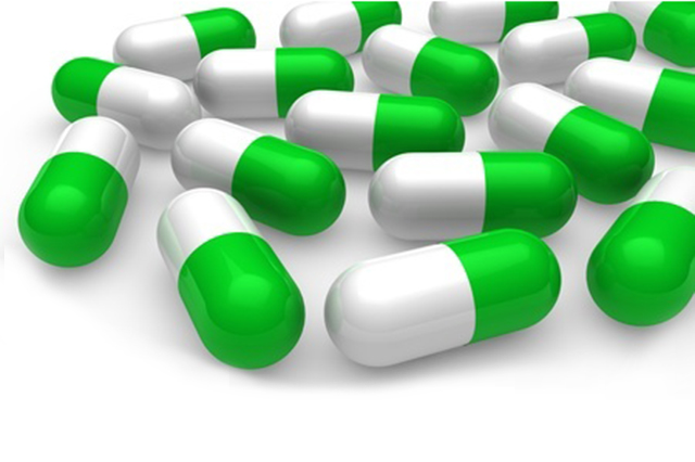 Image of green and white capsules